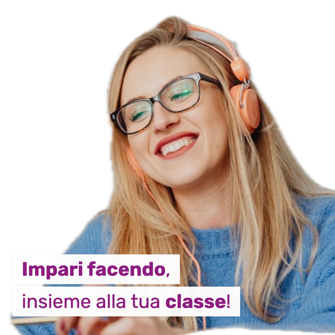 Una studentessa segue la lezione online con le cuffie